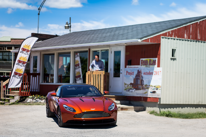 Illustration for article titled Chasing Canada's Greasiest People's Food In A $200,000 Aston Martin